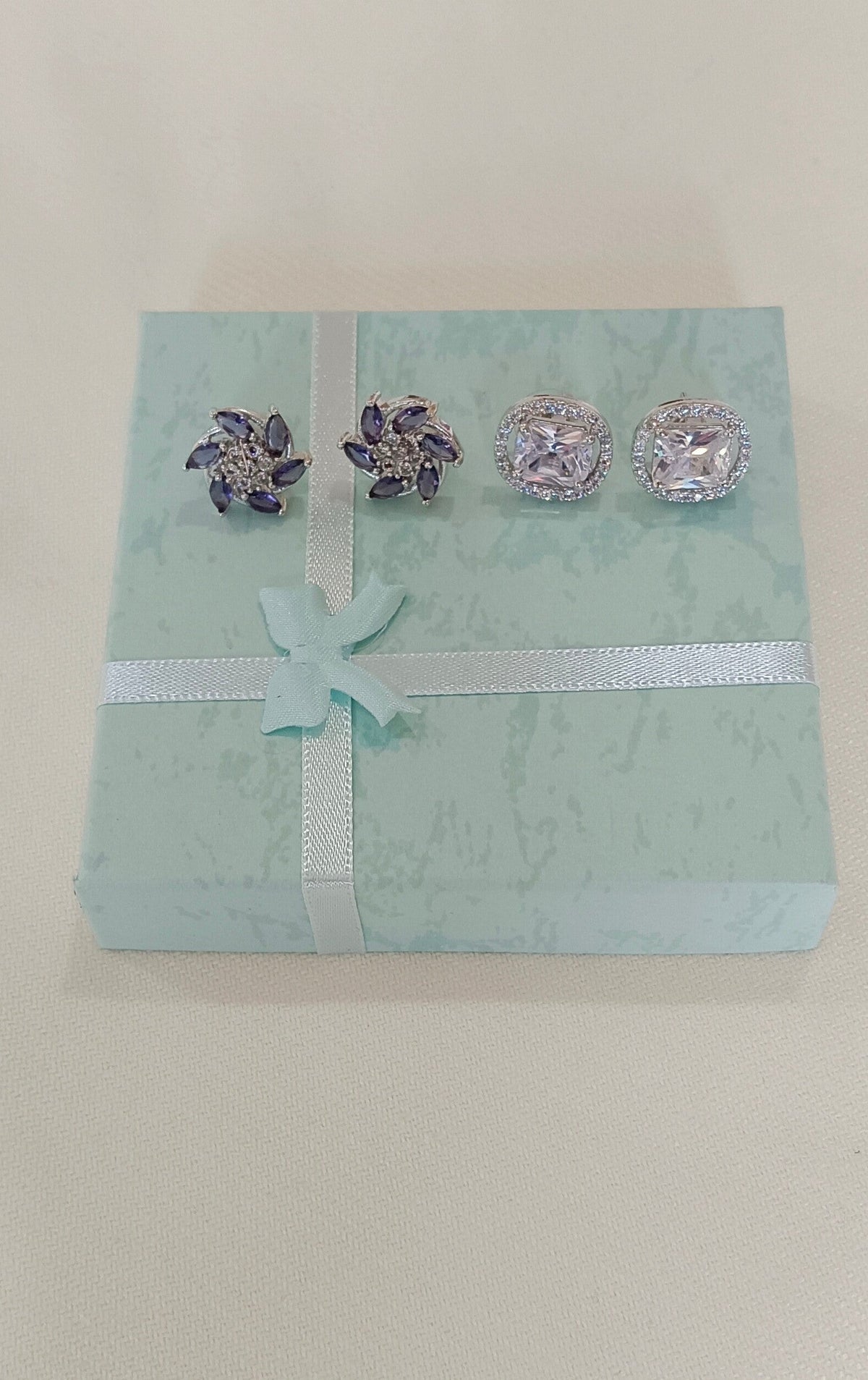 Pack of 2 Stud AD Earrings with White Gold plating Purple floral cluster Stud and White square cut silver toned Stud