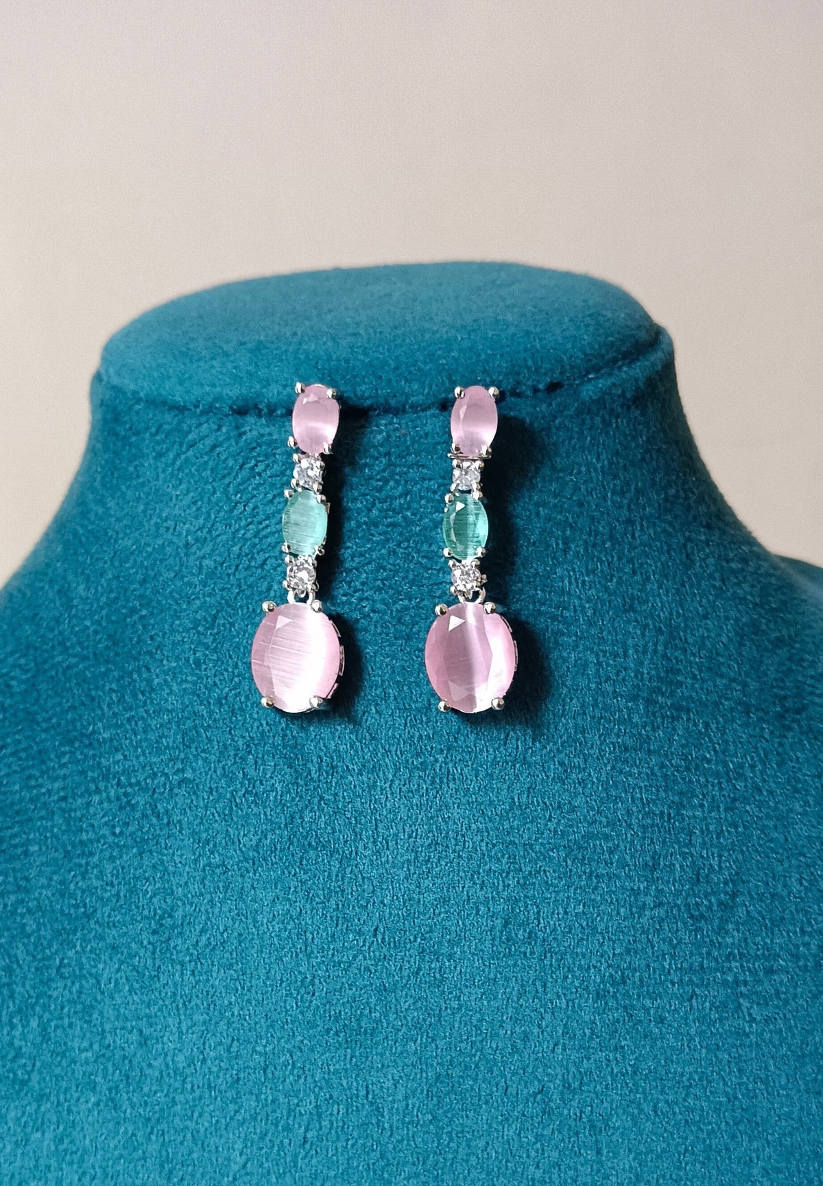 Pink and Mint Green Drop Shaped American Diamond Triple Stone Dangler Earrings