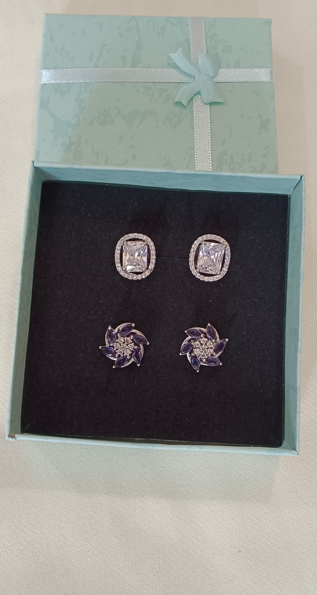 Pack of 2 Stud AD Earrings with White Gold plating Purple floral cluster Stud and White square cut silver toned Stud