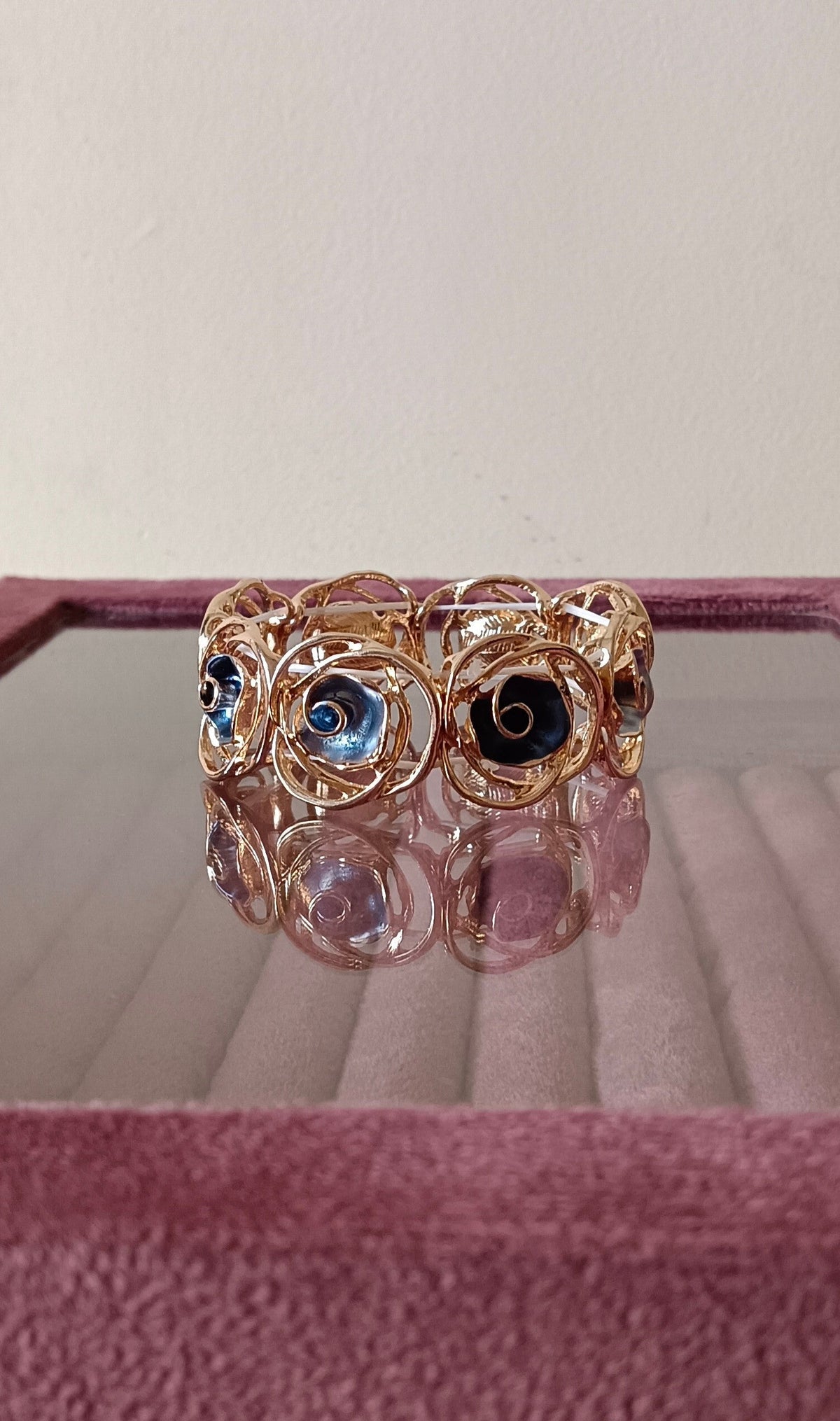 Gold Finish Anti Tarnish Alloy Dark Blue Colored Swirled Panels Stretch Bracelet