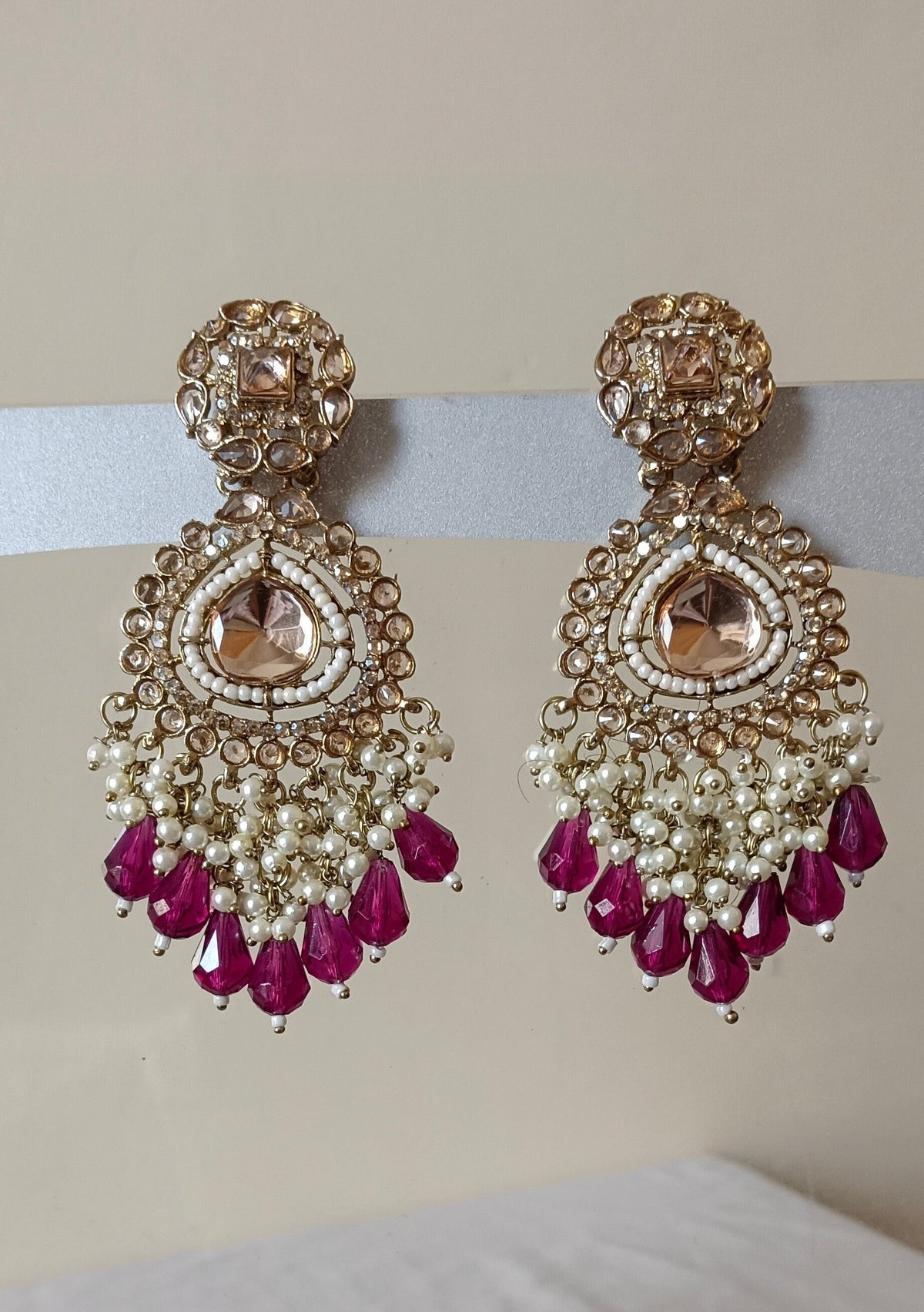 Golden Bahubali Kundan Studded Earrings with Maroon Drop Shape Beads