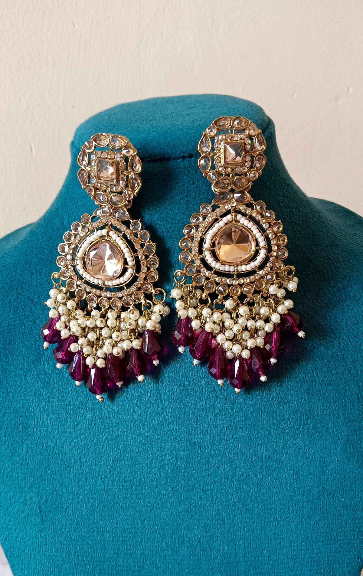 Golden Bahubali Kundan Studded Earrings with Maroon Drop Shape Beads