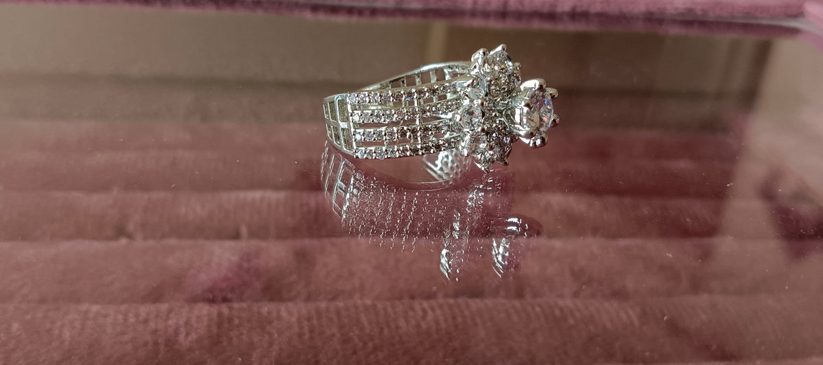 Silver-Plated & White AD Studded Flower Shaped Solitaire Premium Ring